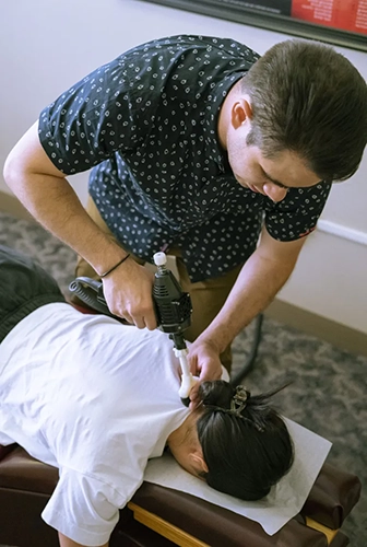 Chiropractor Portland OR Reyn Johnson With Patient